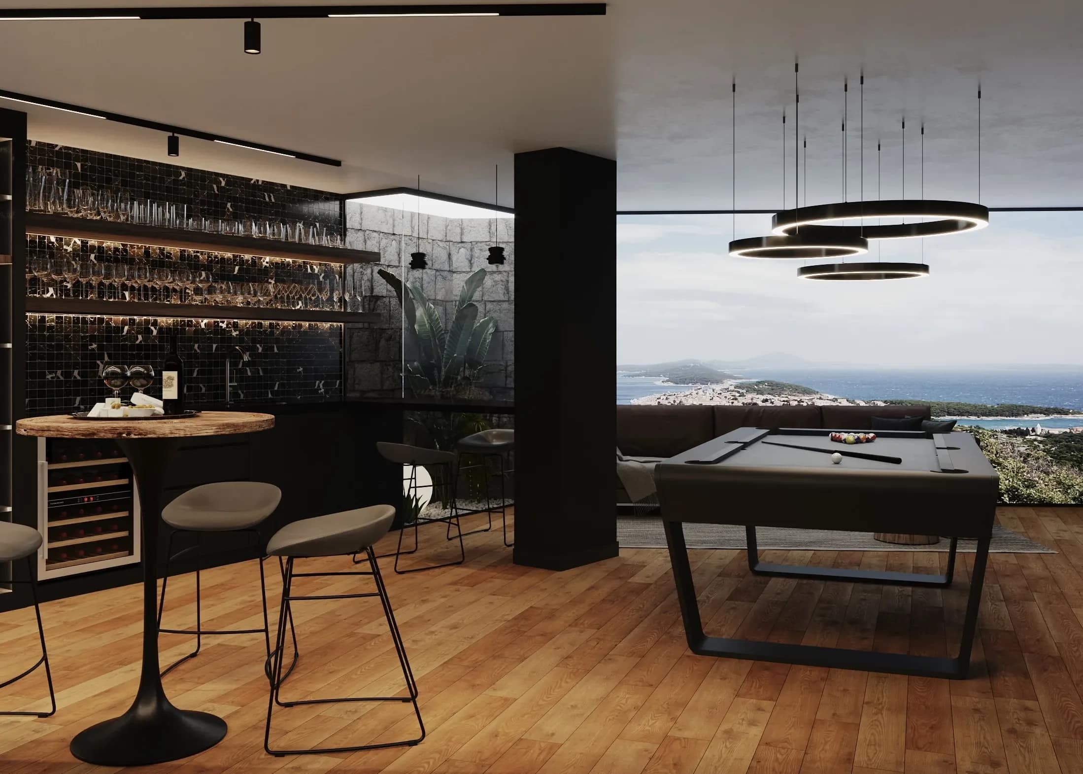 The games lounge — the billiard table, the bar, and the ring pendants