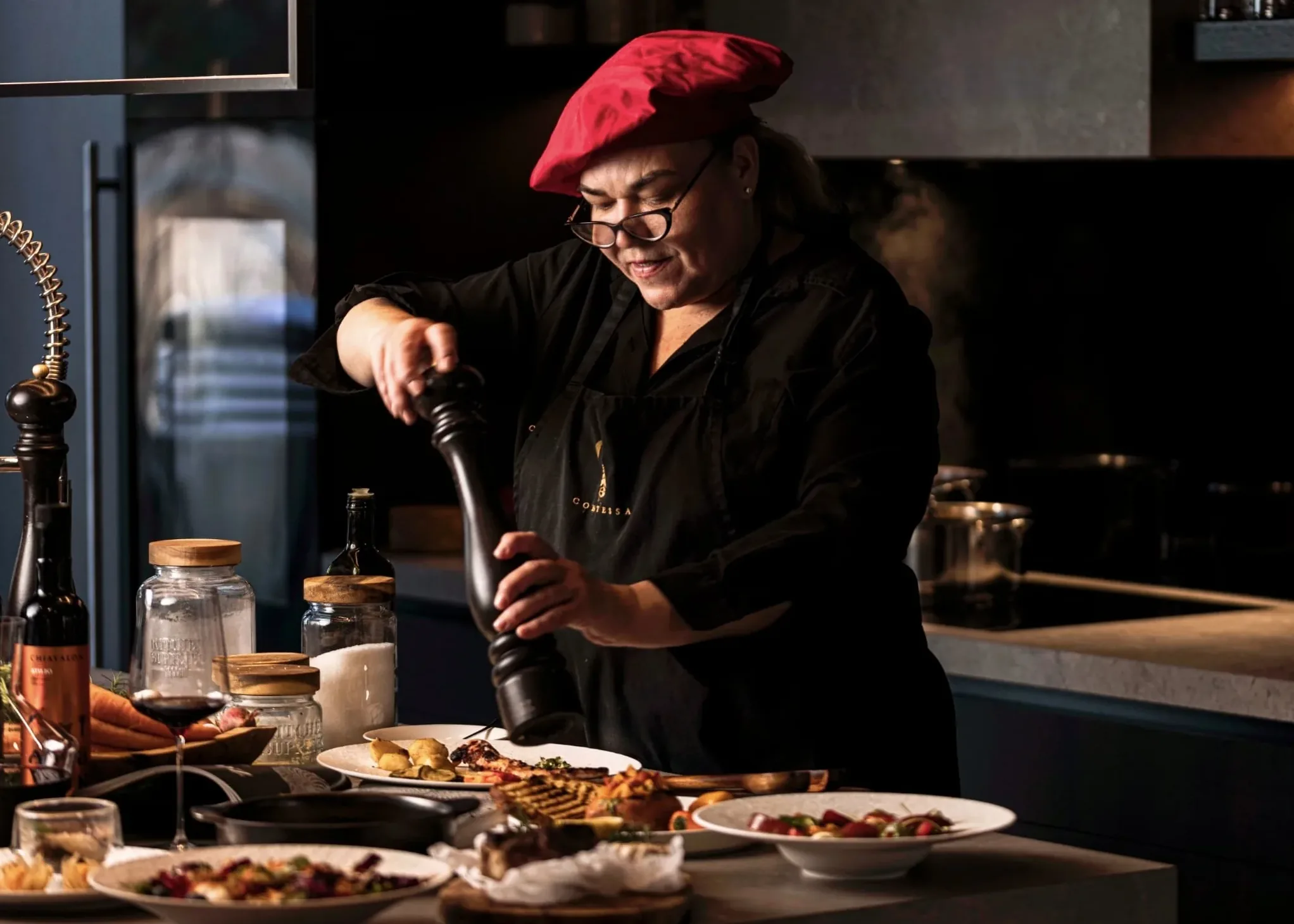 The private chef finishing a dish