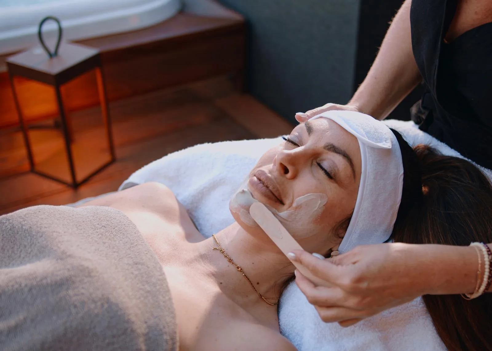 A guest receiving a facial treatment in the spa