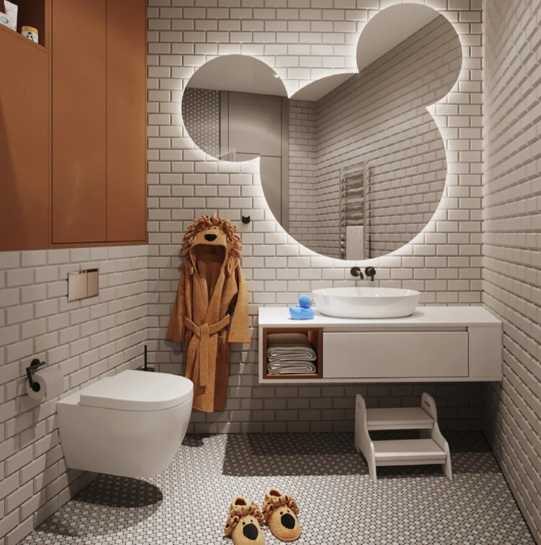 The Mickey Mouse bathroom — round-eared backlit mirror, a lion-mane robe and a step stool at the basin
